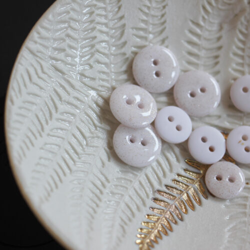 Bouton glitter deux trous - blanc cassé