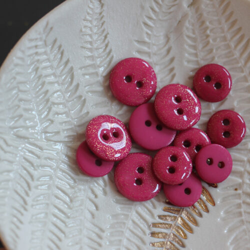 Bouton glitter deux trous - fuchsia